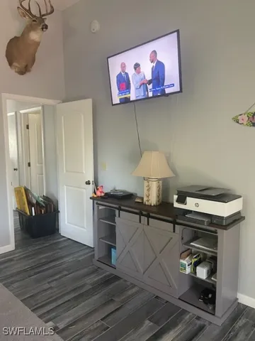 a large bed sitting in a bedroom next to a window