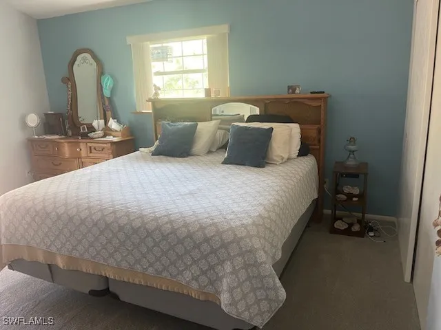 a bathroom with a toilet a sink and shower