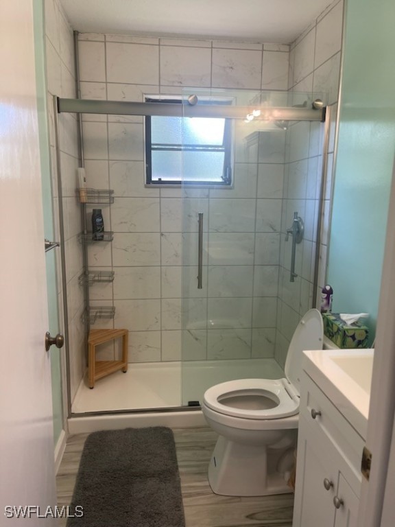 10796 Russell Road Bokeelia, FL 33922 - Photo 28 of 47 a bathroom with a toilet a sink and shower