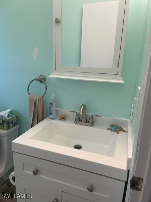 10796 Russell Road Bokeelia, FL 33922 - Photo 29 of 47 a bathroom with a sink and a mirror