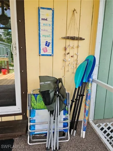a view of deck with chairs and wooden floor