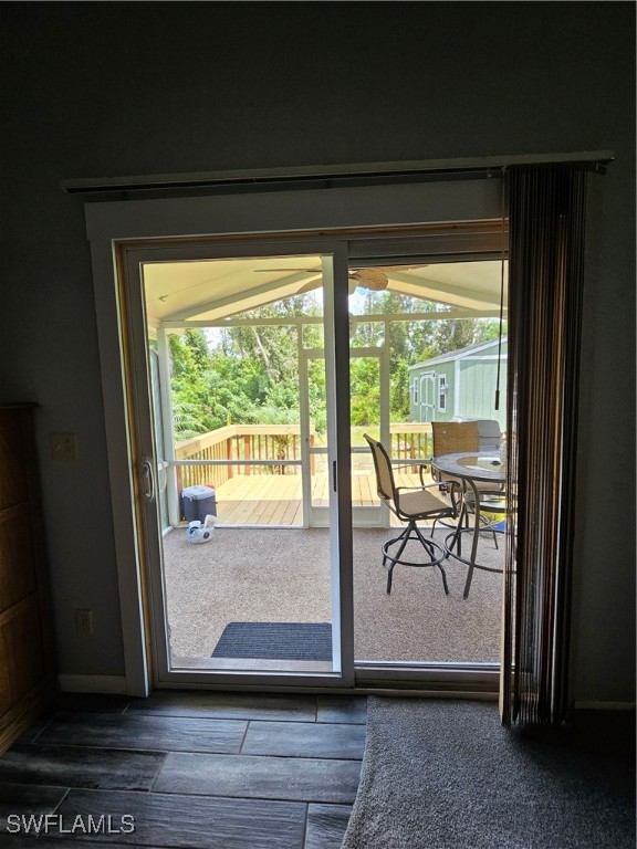 10796 Russell Road Bokeelia, FL 33922 - Photo 39 of 47 a view of a room with wooden floor and furniture