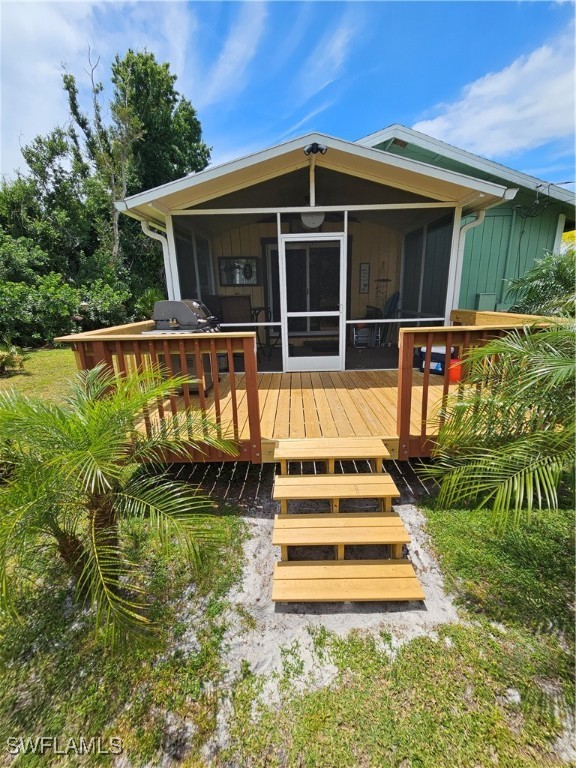 10796 Russell Road Bokeelia, FL 33922 - Photo 4 of 47 a view of a house with a yard