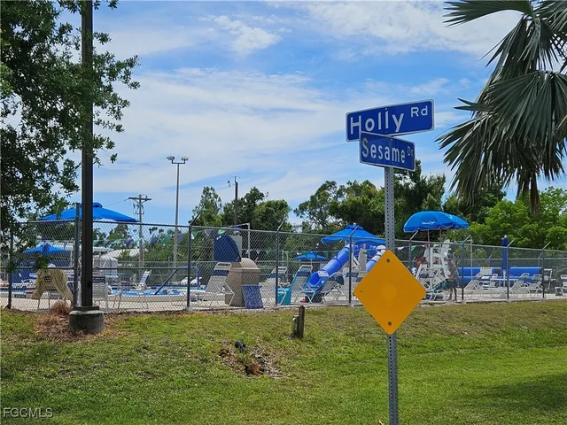 a view of a yard with swimming pool