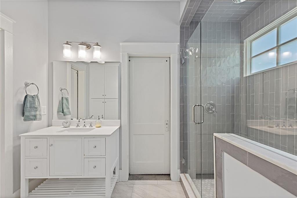 221 3rd Avenue Decatur, GA 30030 - Photo 11 of 37 a bathroom with a double vanity sink mirror and shower