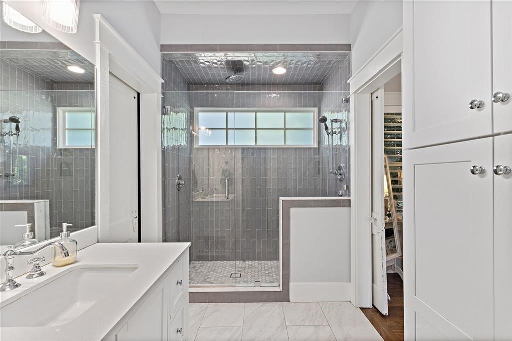 221 3rd Avenue Decatur, GA 30030 - Photo 12 of 37 a bathroom with a sink a shower and a mirror