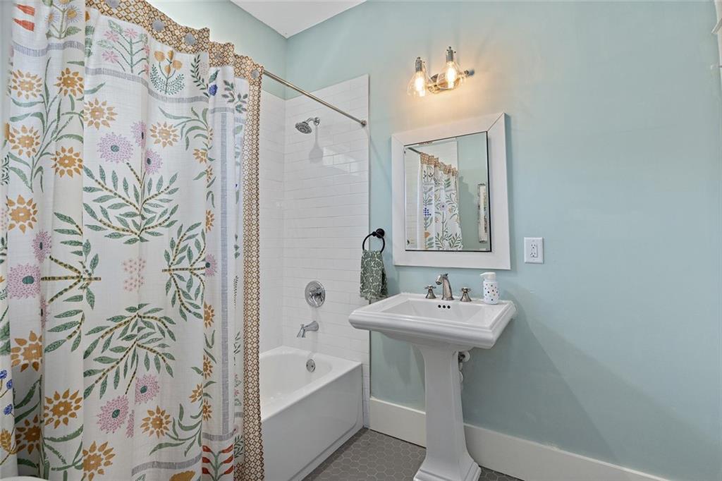 221 3rd Avenue Decatur, GA 30030 - Photo 17 of 37 a bathroom with a sink and a mirror