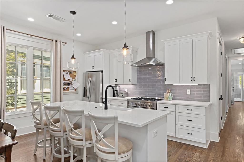 221 3rd Avenue Decatur, GA 30030 - Photo 21 of 37 a kitchen with granite countertop a sink stainless steel appliances and window