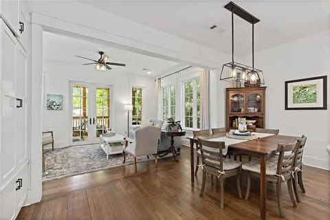 a view of a dining room with furniture window and wooden floor