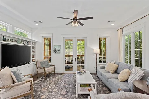 a living room with furniture and a flat screen tv