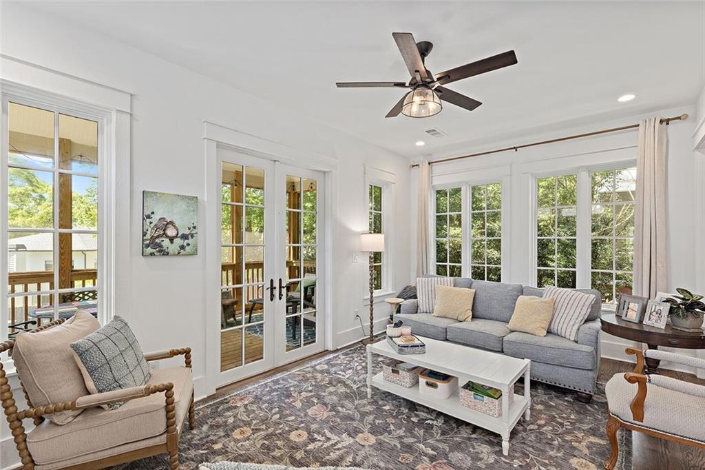 221 3rd Avenue Decatur, GA 30030 - Photo 29 of 37 a living room with furniture and a large window with wooden floor