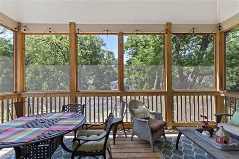 a view of a living room and wooden floor