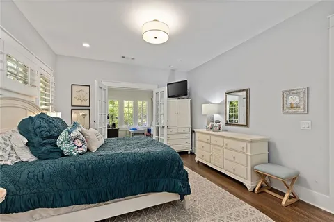 a bedroom with a large bed and a window