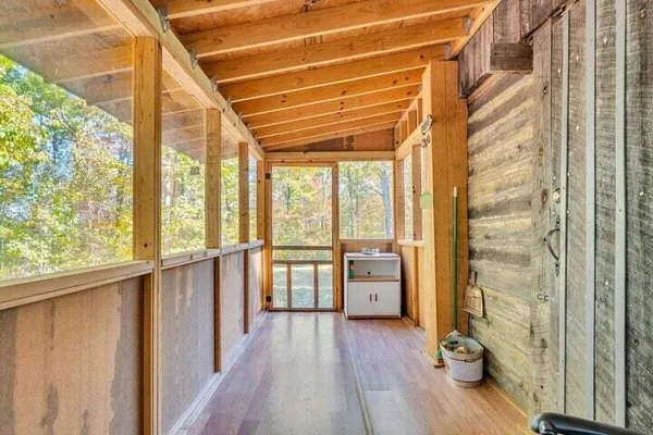 a backyard of a house with table and chairs