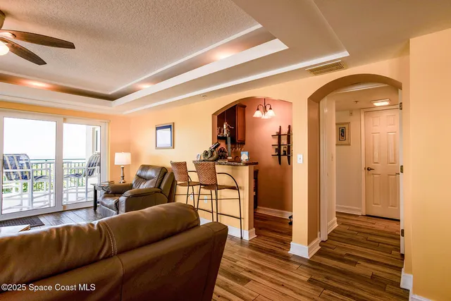 a bedroom with bed and a chandelier