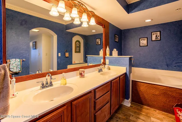 a bathroom with a tub and a sink