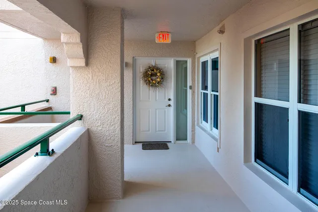 a view of a kitchen from the hallway