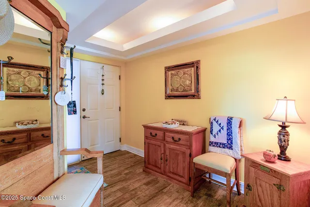 a dining room with furniture and wooden floor