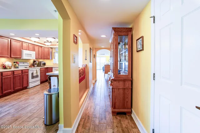 a kitchen with a stove a sink and a refrigerator