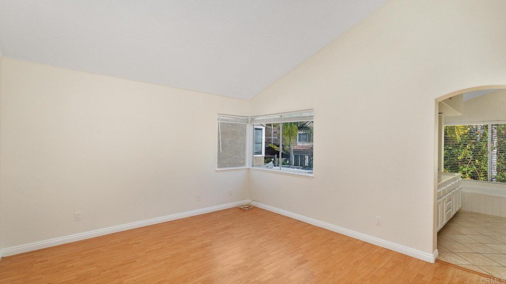 5979 Corte Playa Pacifica San Diego, CA 92124 - Photo 16 of 38 an empty room with windows