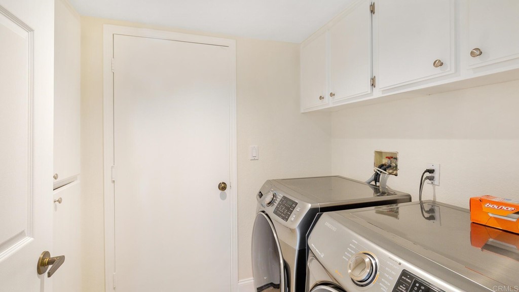 5979 Corte Playa Pacifica San Diego, CA 92124 - Photo 20 of 38 a utility room with dryer and washer