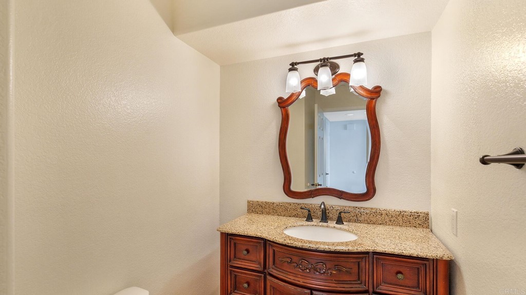 5979 Corte Playa Pacifica San Diego, CA 92124 - Photo 22 of 38 a bathroom with a sink and a mirror