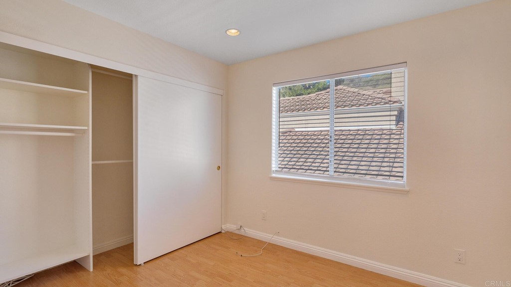 5979 Corte Playa Pacifica San Diego, CA 92124 - Photo 24 of 38 a view of an empty room with a window and a kitchen