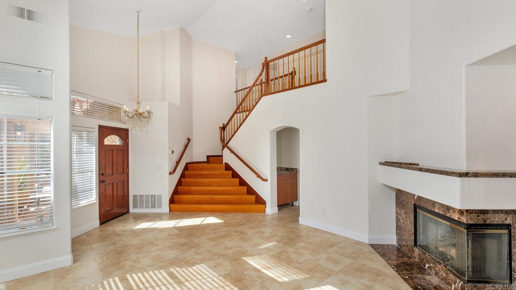 5979 Corte Playa Pacifica San Diego, CA 92124 - Photo 7 of 38 a view of entryway and hall with wooden floor