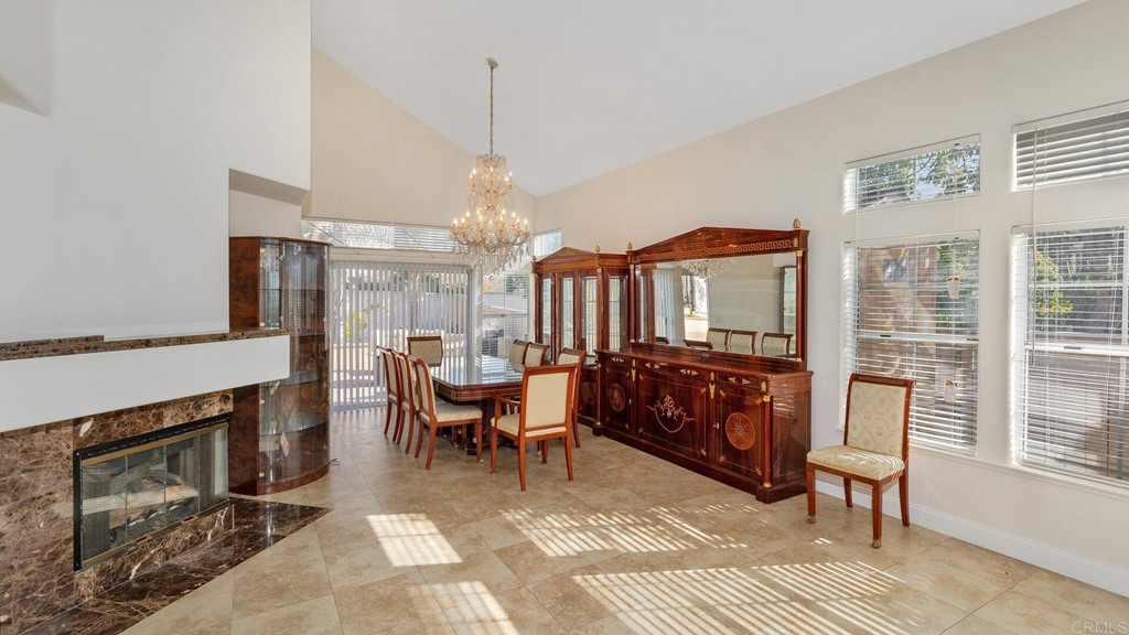 5979 Corte Playa Pacifica San Diego, CA 92124 - Photo 9 of 38 a bedroom with furniture a fireplace and windows