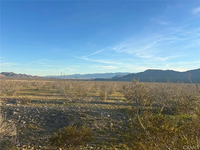 a view of an ocean with a mountain