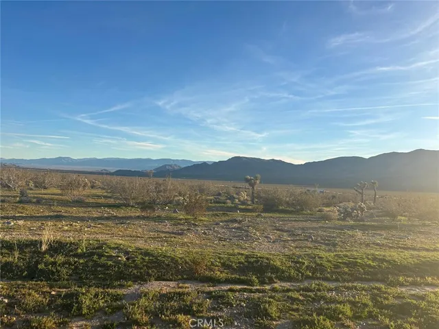 a view of an ocean with a mountain