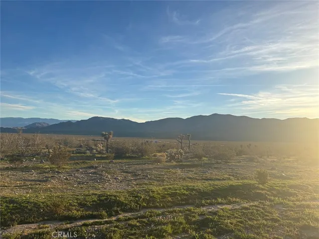 a view of an ocean with a mountain