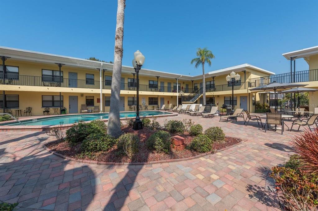 16333 Gulf Boulevard, Unit 204 Redington Beach, FL 33708 - Photo 2 of 43 a view of a building with sitting area