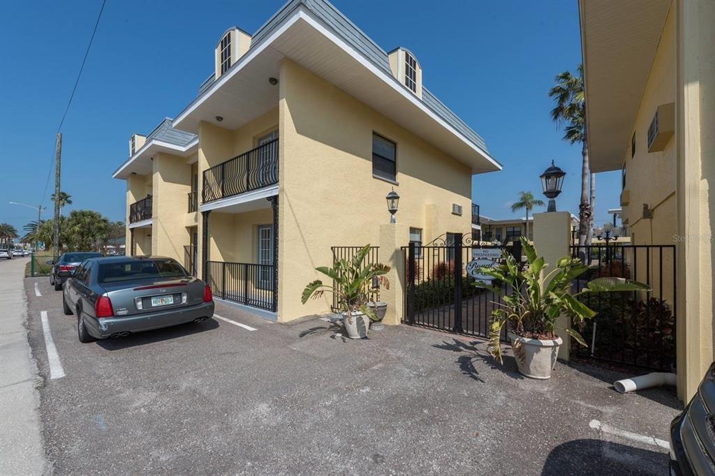 16333 Gulf Boulevard, Unit 204 Redington Beach, FL 33708 - Photo 2 of 43 a view of car parked in front of house