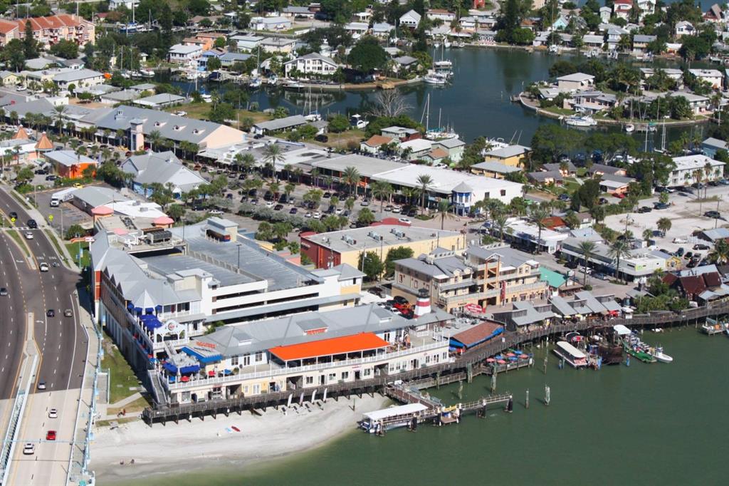16333 Gulf Boulevard, Unit 204 Redington Beach, FL 33708 - Photo 21 of 43 an aerial view of residential houses with outdoor space and lake view