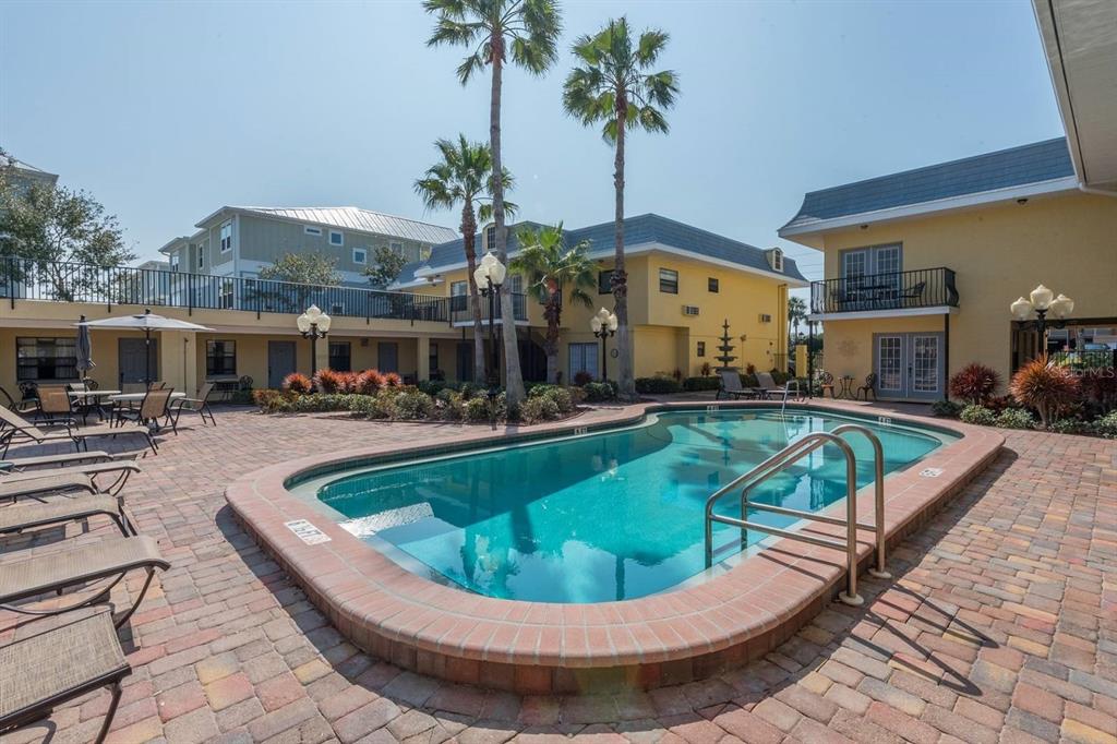 16333 Gulf Boulevard, Unit 204 Redington Beach, FL 33708 - Photo 5 of 43 a view of a swimming pool with a patio