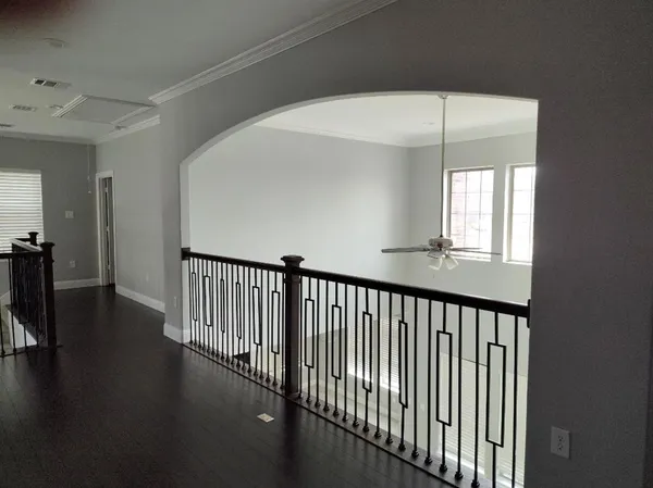 a view of a hallway with windows