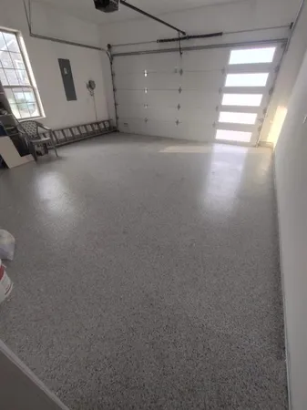 a view of a room with window and a ceiling fan