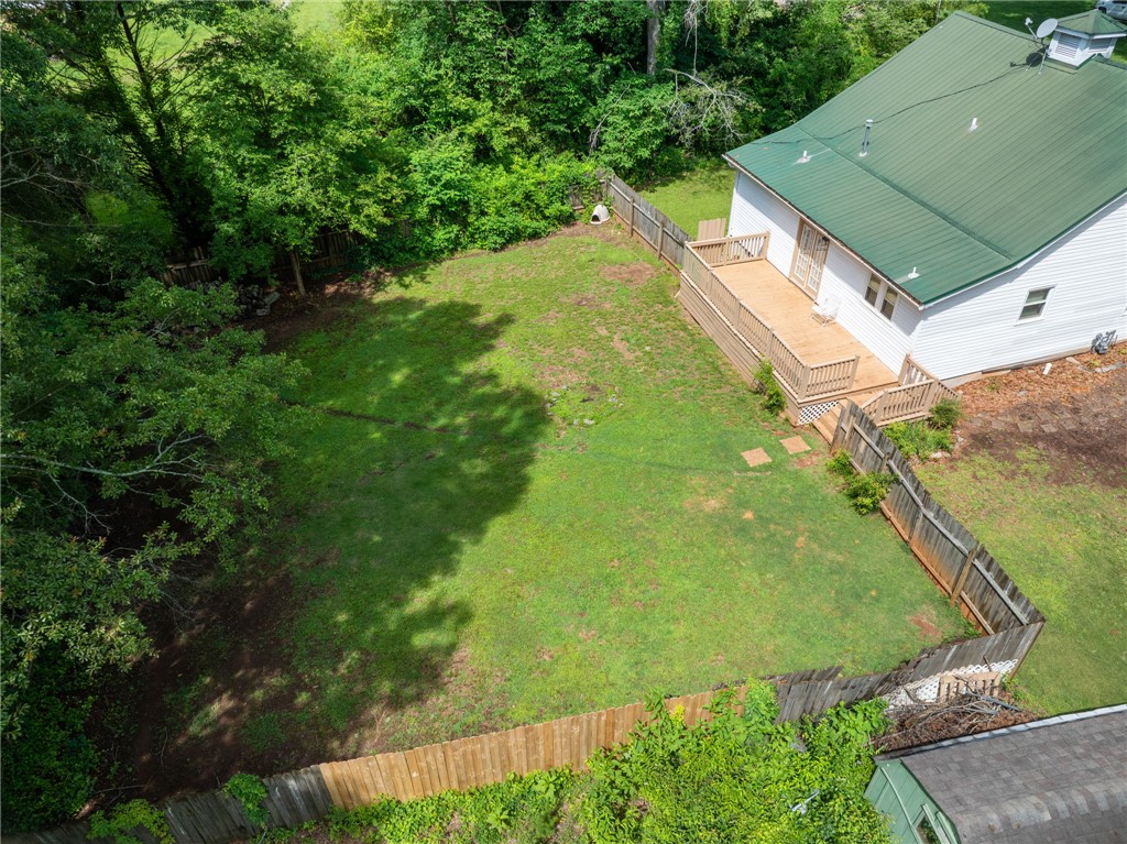 108 Tarrant Street Central, SC 29630 - Photo 36 of 42 Fenced yard with abundant green space and a welcoming deck for outdoor enjoyment.