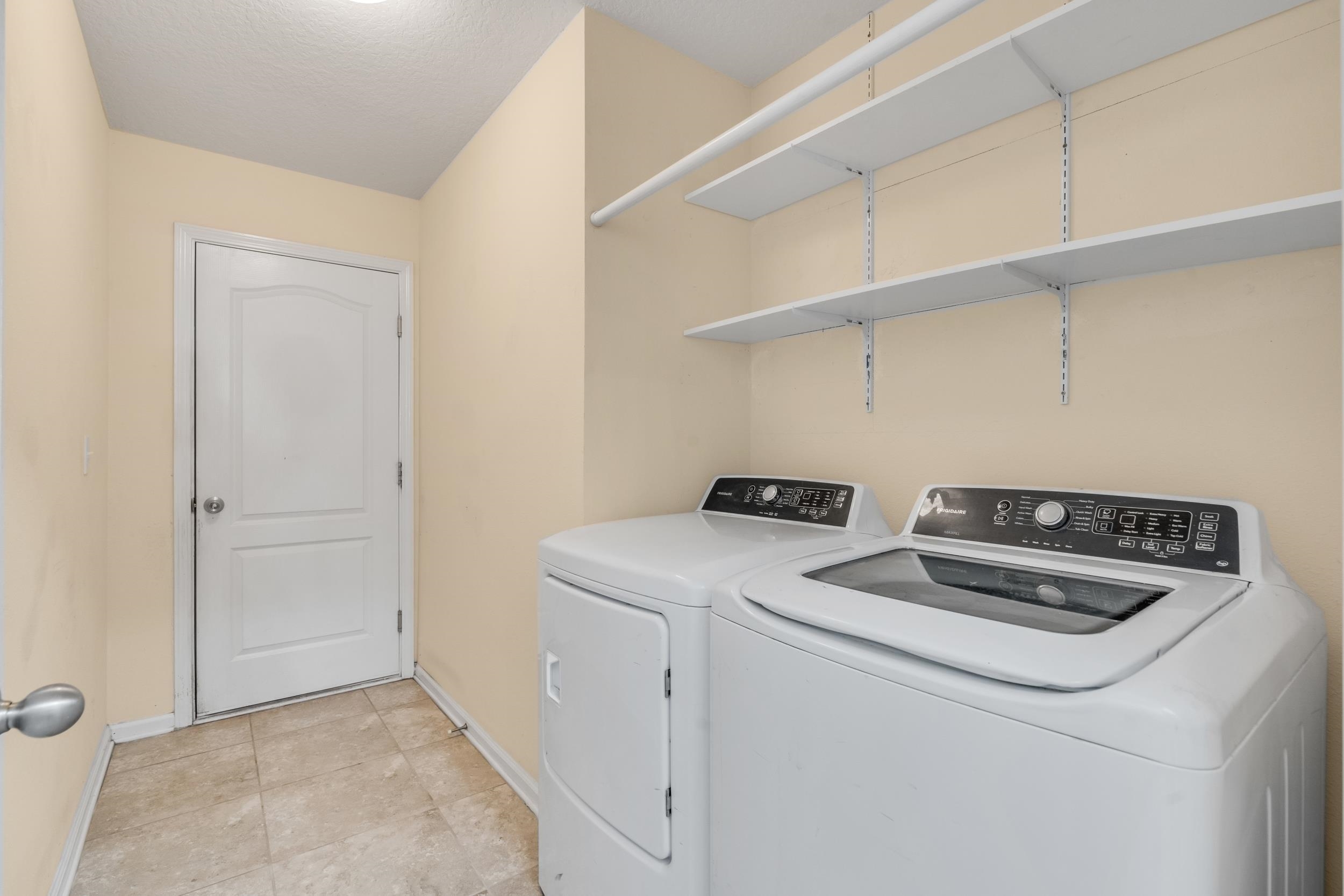228 Fox Water Trail St. Augustine, FL 32086 - Photo 11 of 50 a utility room with dryer and washer