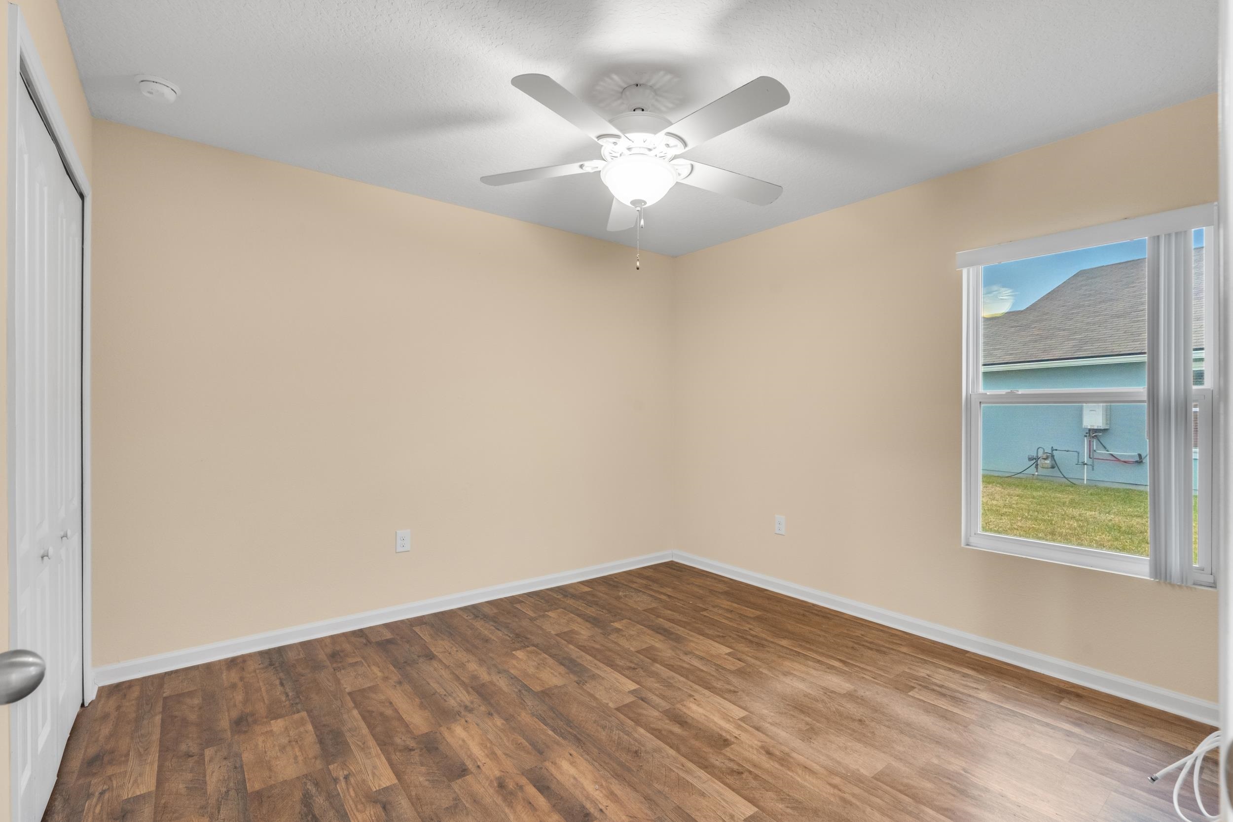228 Fox Water Trail St. Augustine, FL 32086 - Photo 13 of 50 wooden floor in an empty room