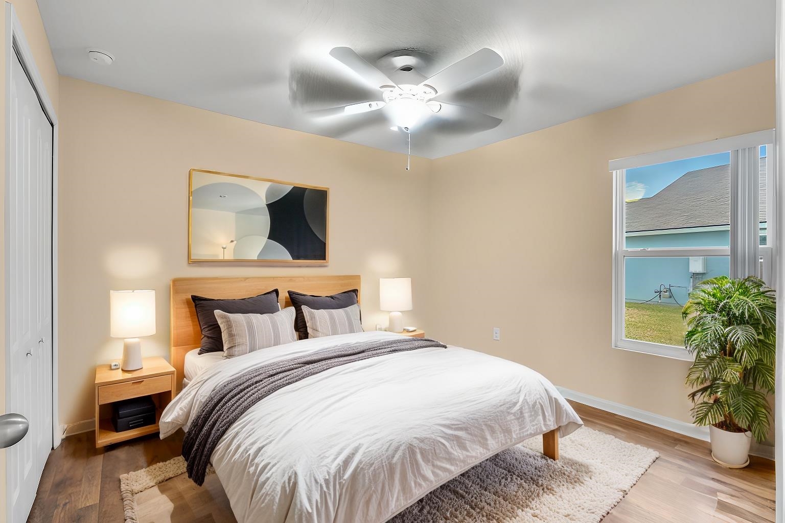 228 Fox Water Trail St. Augustine, FL 32086 - Photo 14 of 50 a bedroom with a large bed and a chandelier