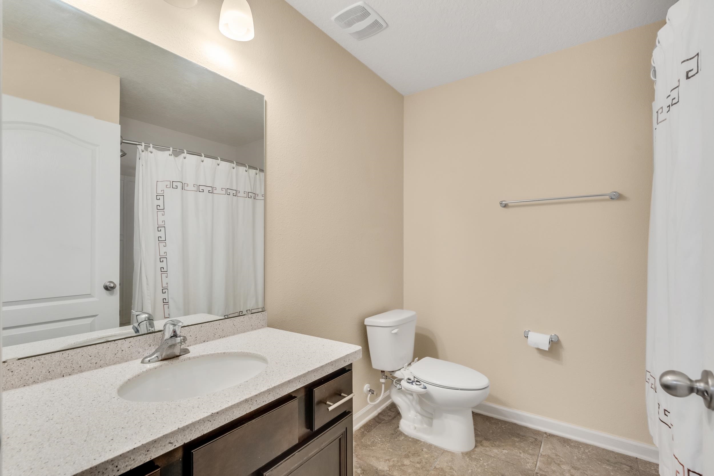 228 Fox Water Trail St. Augustine, FL 32086 - Photo 16 of 50 a bathroom with a sink vanity mirror and toilet