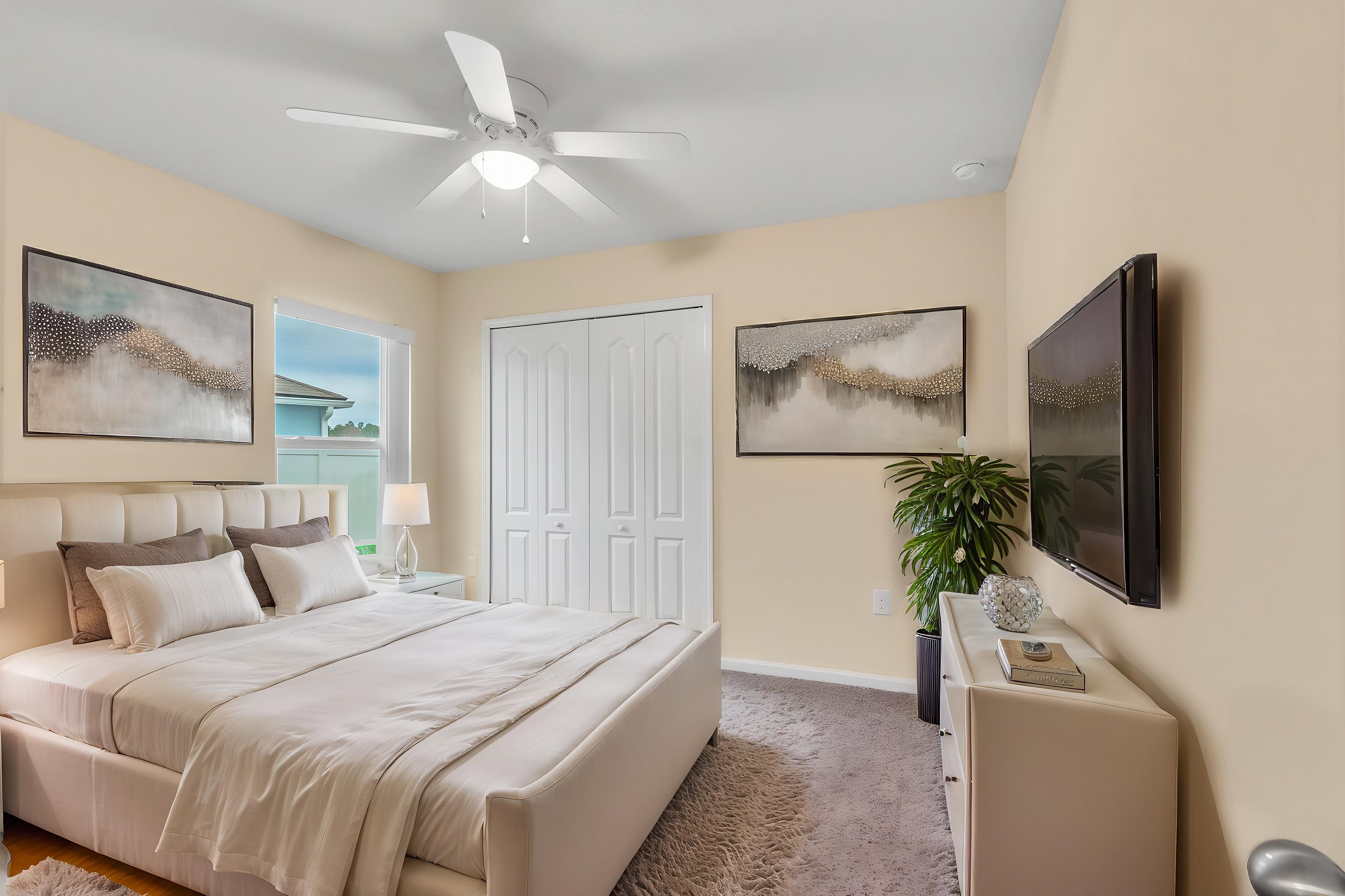 228 Fox Water Trail St. Augustine, FL 32086 - Photo 18 of 50 a bedroom with a bed and a flat screen tv