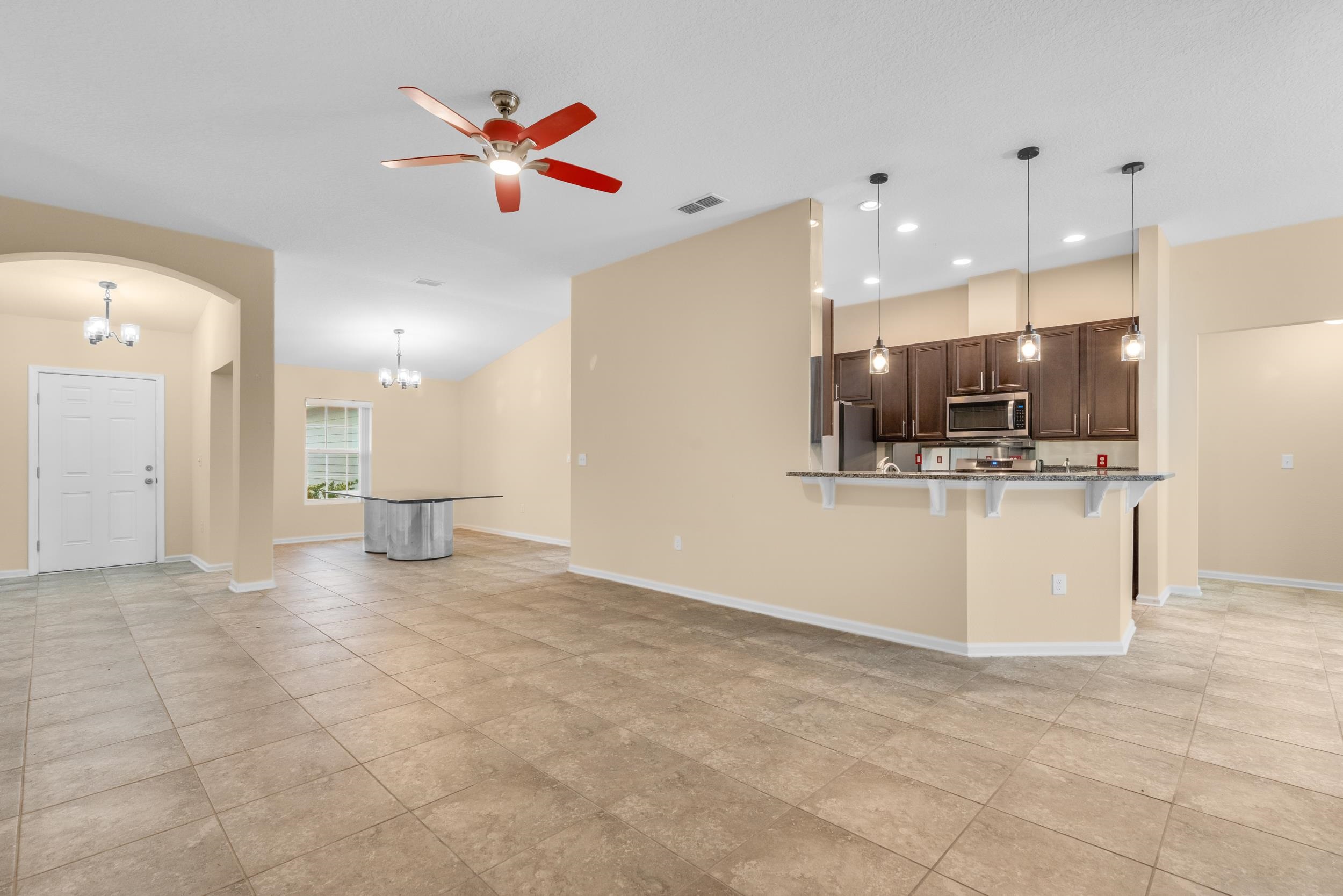 228 Fox Water Trail St. Augustine, FL 32086 - Photo 20 of 50 a view of a kitchen with a stove cabinets and a kitchen view
