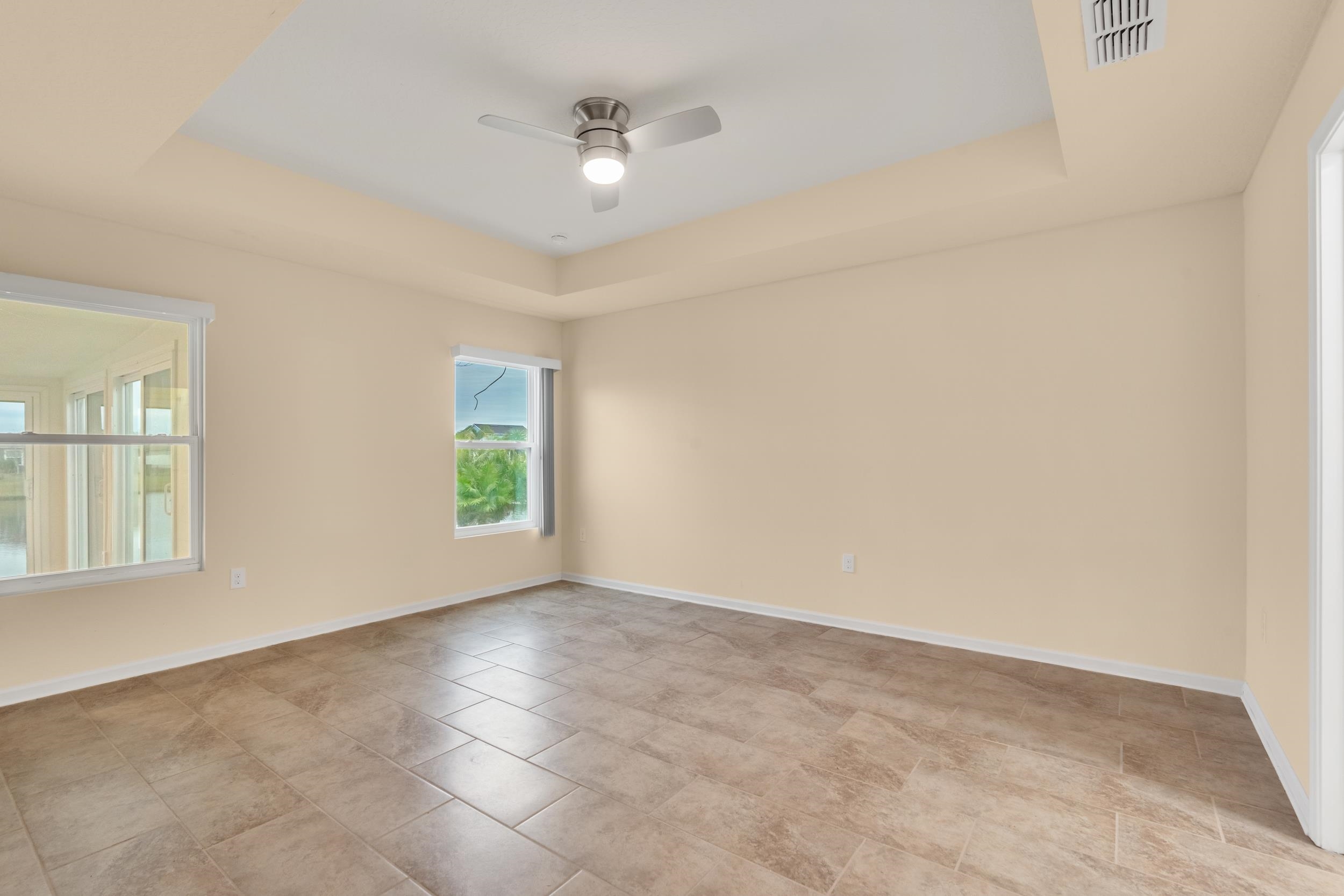 228 Fox Water Trail St. Augustine, FL 32086 - Photo 32 of 50 an empty room with windows and fan