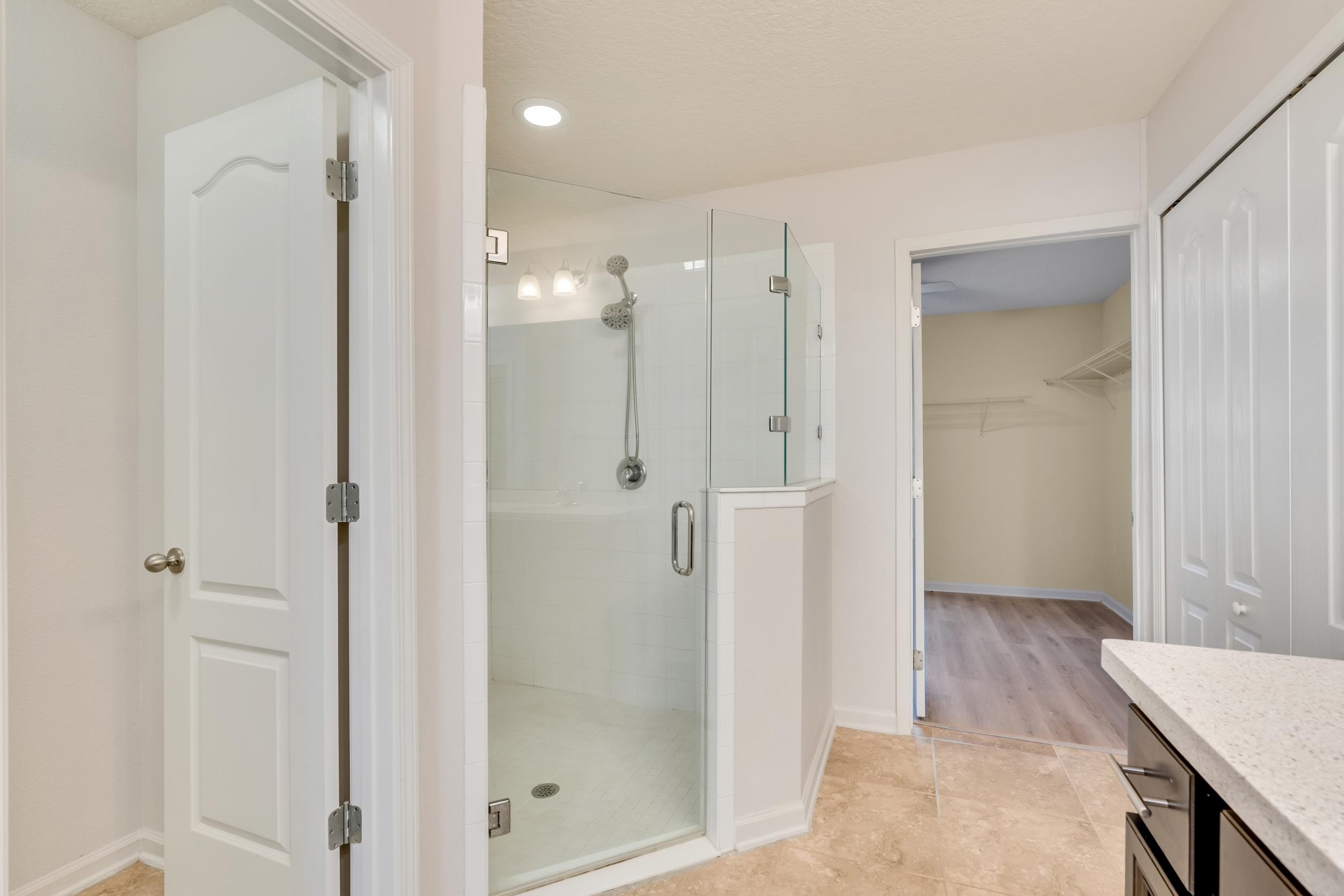 228 Fox Water Trail St. Augustine, FL 32086 - Photo 36 of 50 a bathroom with a shower and a glass door