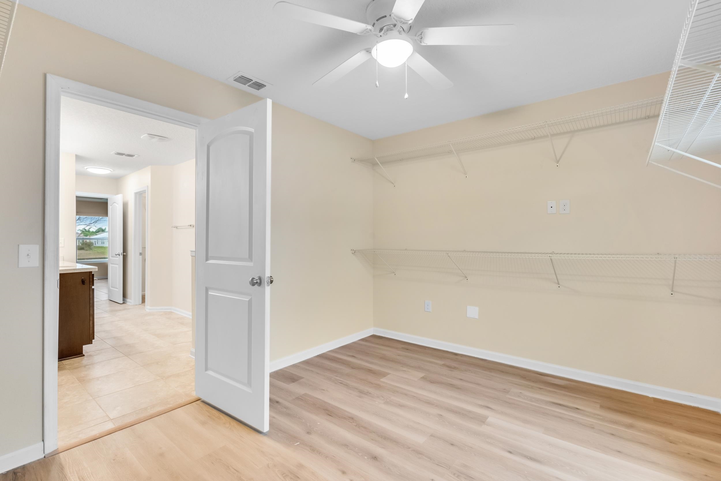 228 Fox Water Trail St. Augustine, FL 32086 - Photo 38 of 50 wooden floor in an empty room