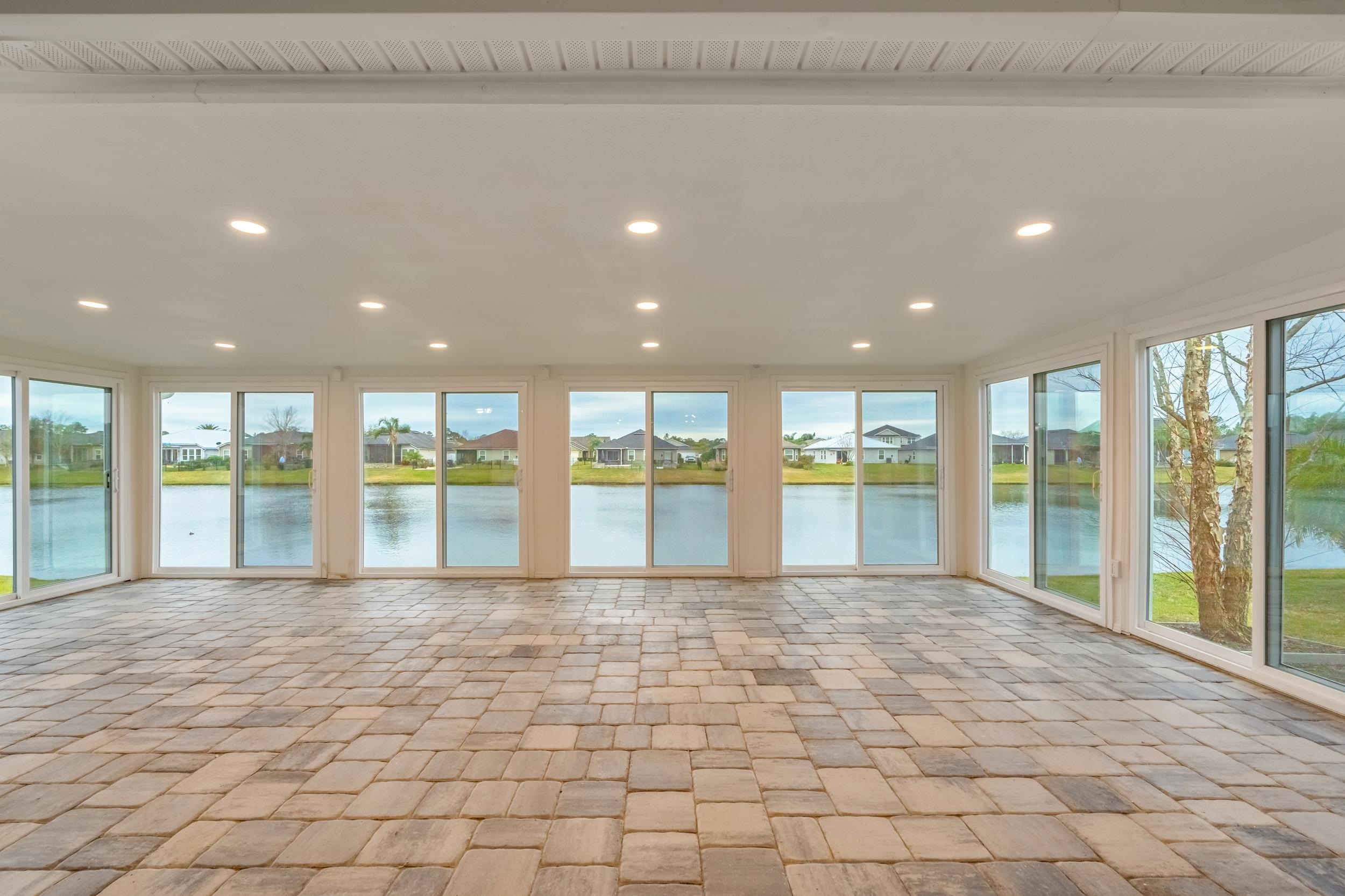 228 Fox Water Trail St. Augustine, FL 32086 - Photo 40 of 50 a view of an empty room with glass door and balcony