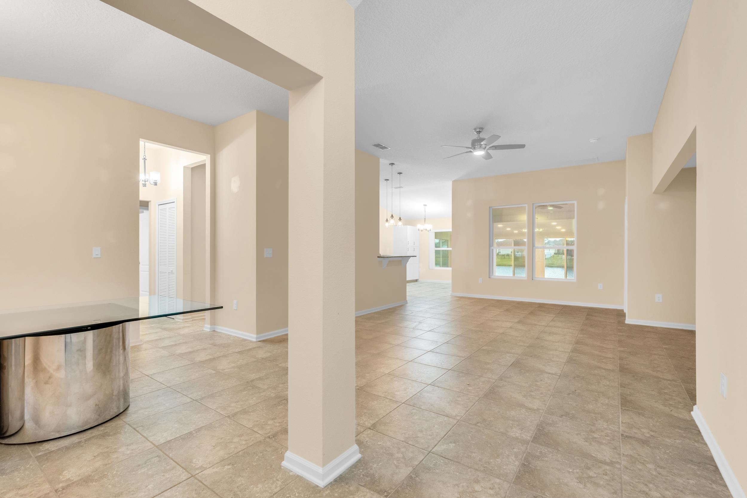 228 Fox Water Trail St. Augustine, FL 32086 - Photo 4 of 50 a view of an empty room with a window